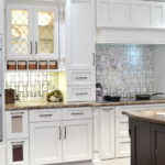 Design of a white kitchen in the interior in a classic style