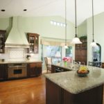 design of a large kitchen with stone countertops