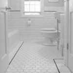 Witte badkamer honingraat tegelvloer