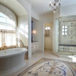 Large bright bathroom with mosaic on the floor