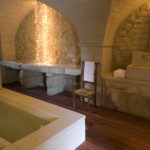Large bathtub catacomb style made of rough stone
