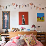 Decor for children's room paintings and garlands of flags on the wall