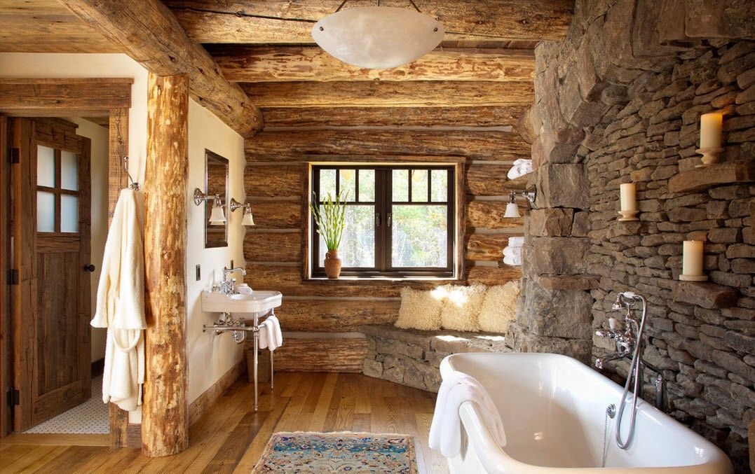 Design del bagno in una casa di legno con finiture in pietra naturale