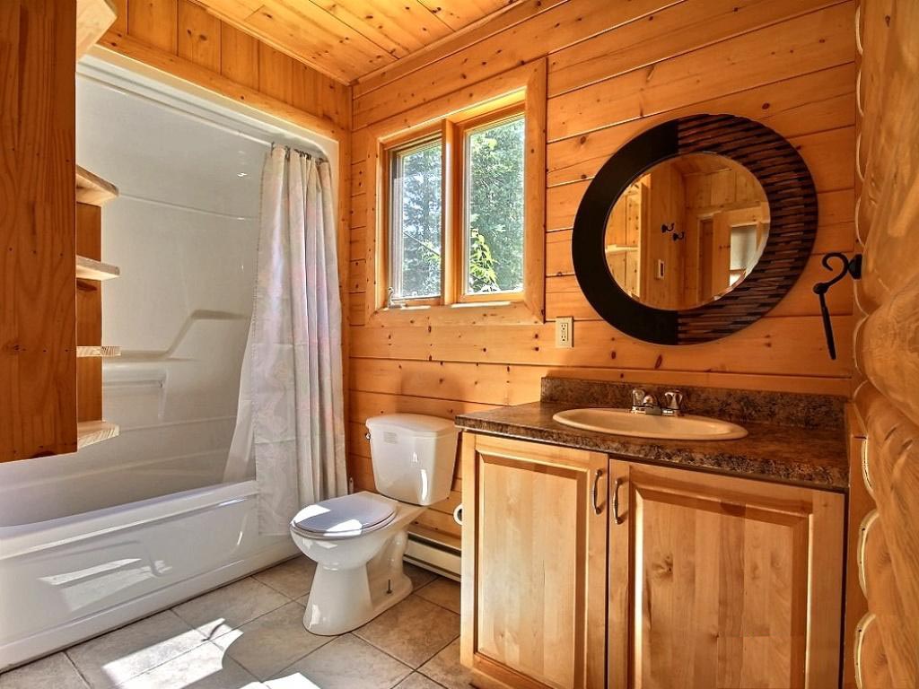 Projekt łazienki w domu z drewnianego domu z bali