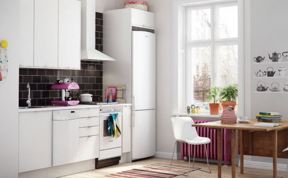 White refrigerator in the interior of the kitchen