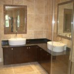 Spacious bathroom with beige tiles