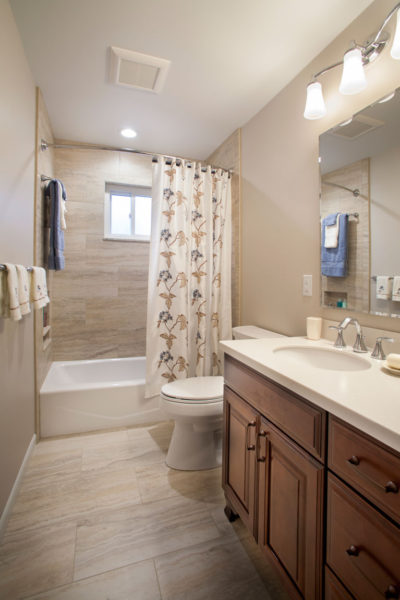 Design a narrow beige bathroom
