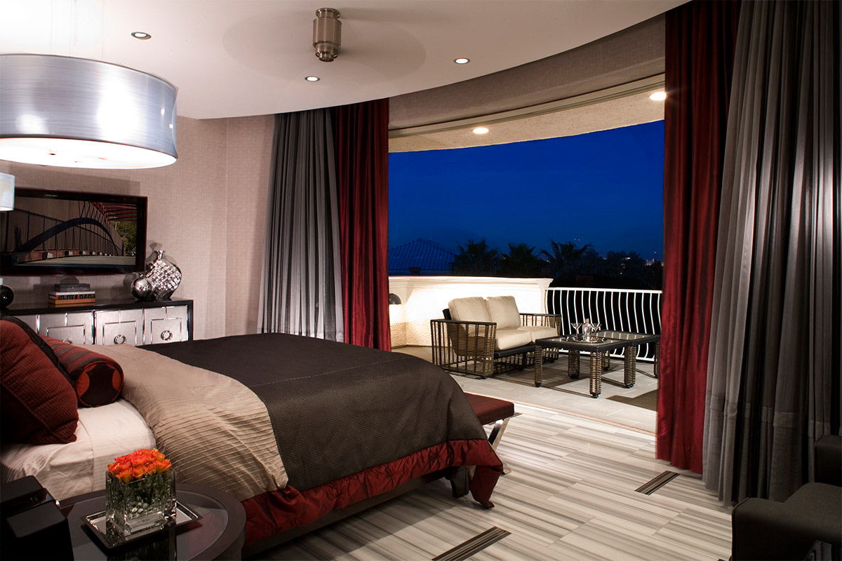 bedroom with a balcony in dark colors