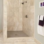 Shower cabin in a beige bathtub