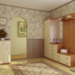 Decoration of the hallway with wallpaper and a modular wardrobe