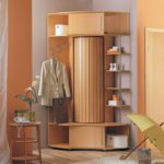 Beige-colored hallway with corner wardrobe for clothes and shoes