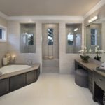 Contemporary bathroom design with corner bathtub and shower stall
