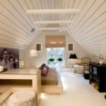 Isang halimbawa ng isang light style bedroom sa attic photo