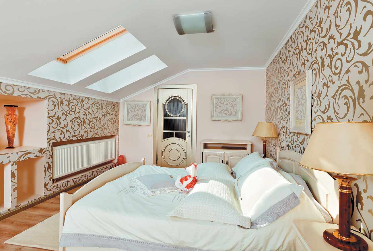 example of a bright interior of a bedroom in the attic