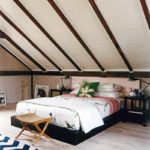 example of a bright interior of a bedroom in the attic photo