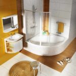 example of an unusual design of a bathroom with a corner bathtub photo