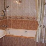 version of the unusual style of the bathroom with tile lining photo