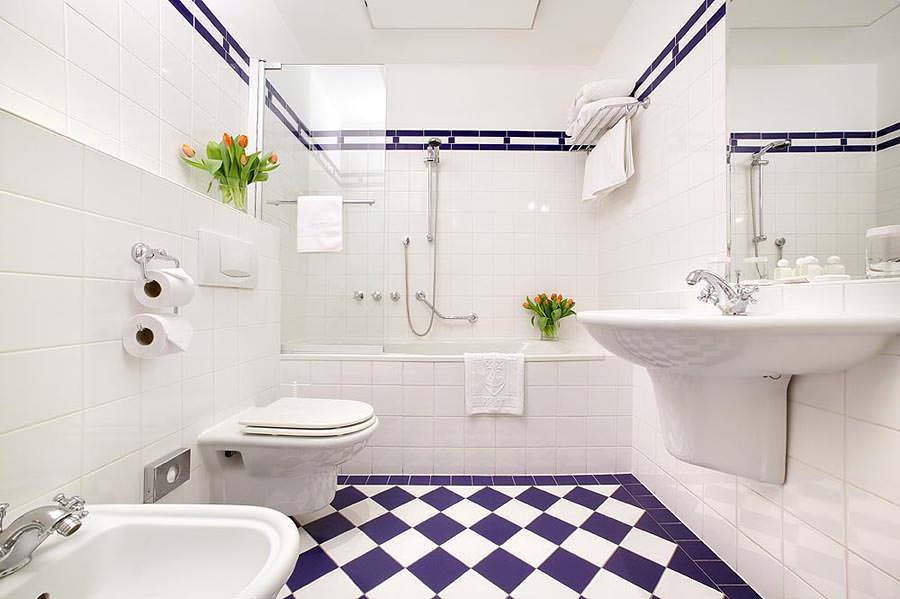 Purple tile in white bathroom interior