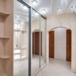 Wardrobe with mirrors in the design of the corridor in the apartment