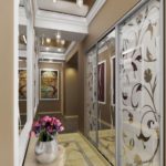 Doors with stained-glass windows on cabinets in the hallway