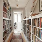 Bookshelves in an elongated corridor