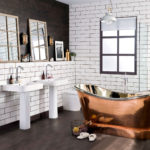 Copper bathtub on a wooden floor