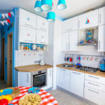 Blue lampshades in a marine style kitchen