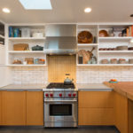 White open shelves in the kitchen of a private house