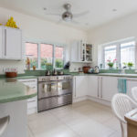 Kitchen interior with two windows in a country house