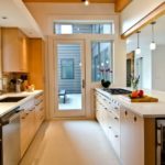 Walk-through kitchen with a door to the courtyard of a private house