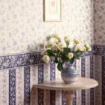 Pasting the bedroom wall with wallpaper with a border