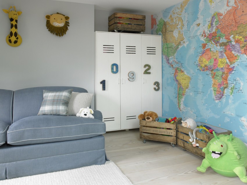 Gray sofa in the nursery with photo wallpaper