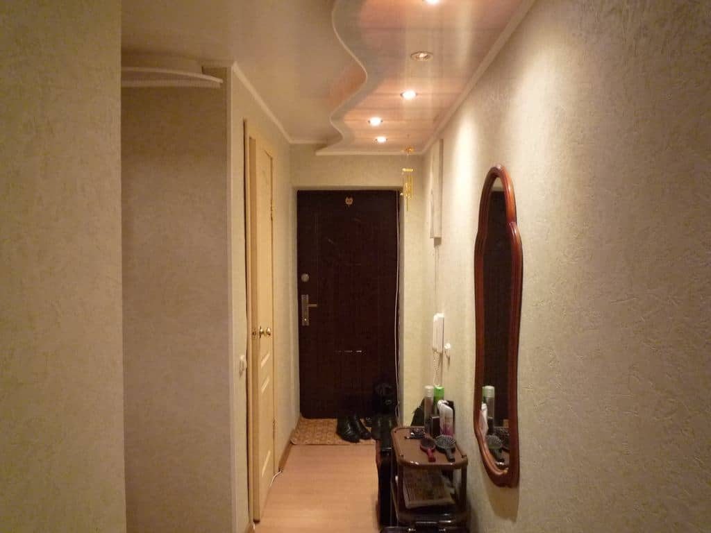 Beautiful backlit ceiling in a narrow corridor