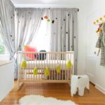 Pale gray curtains in the baby's room