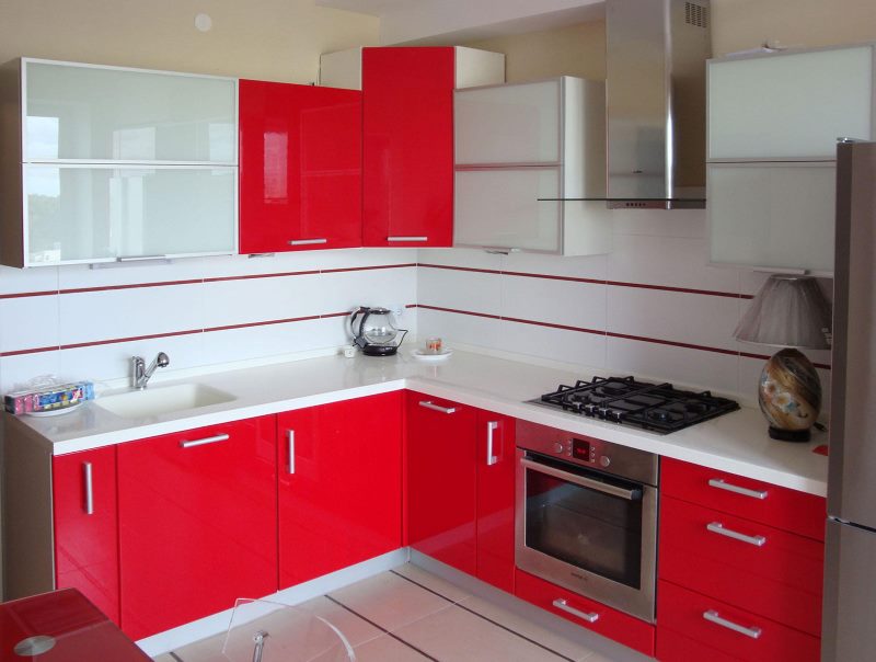 Red and white furniture in a small kitchen