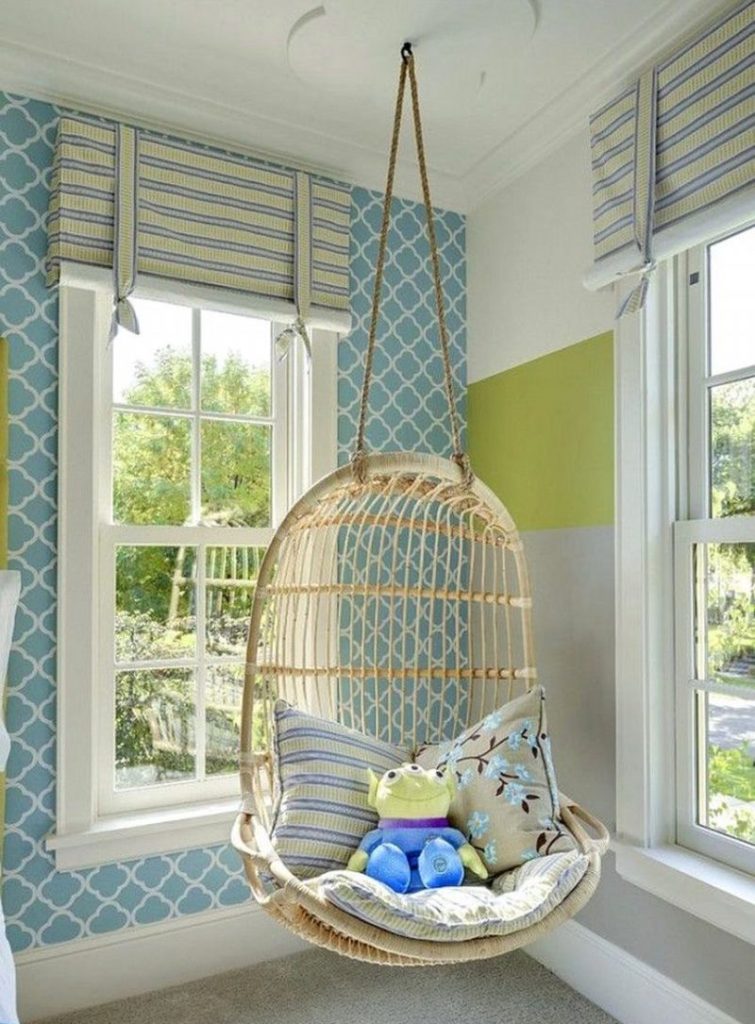 Hanging chair on the background of wallpaper with a pattern