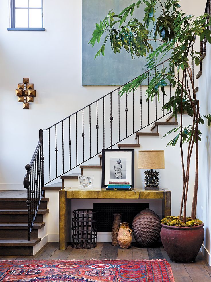 Staircase with metal railing in the corridor of a private house