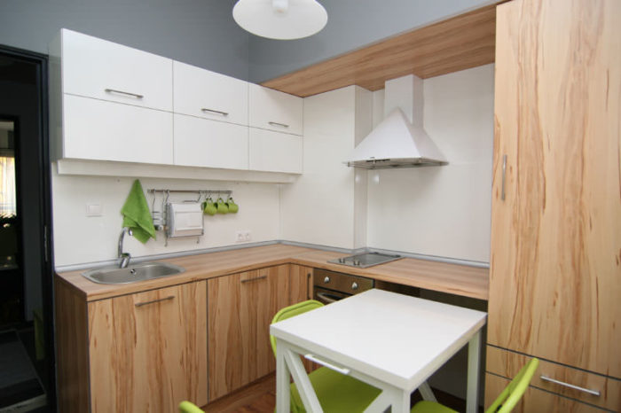 White hanging cabinets and brown floor cupboards
