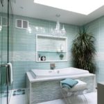 Marine patterns in the bathroom are achieved using two types of tiles