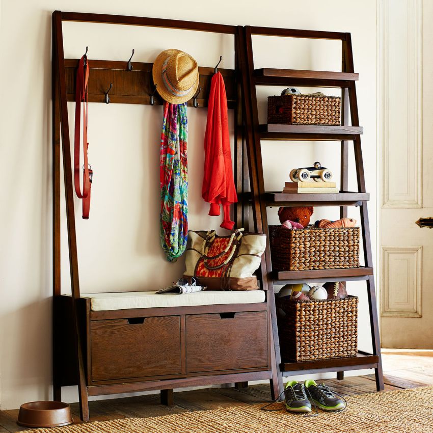 Clothes hanger with shelves for things in the hallway of a private house