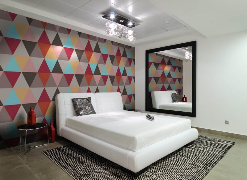 Wall decoration in the bedroom with wallpaper with rhombuses