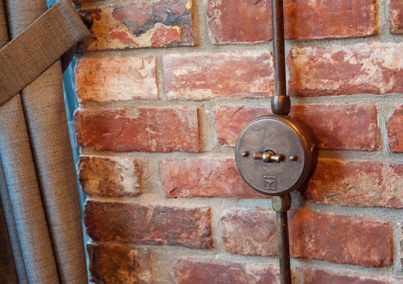 Vintage switch on a brick wall