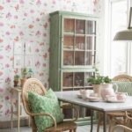 Cozy dining area with wicker furniture and handmade pillows