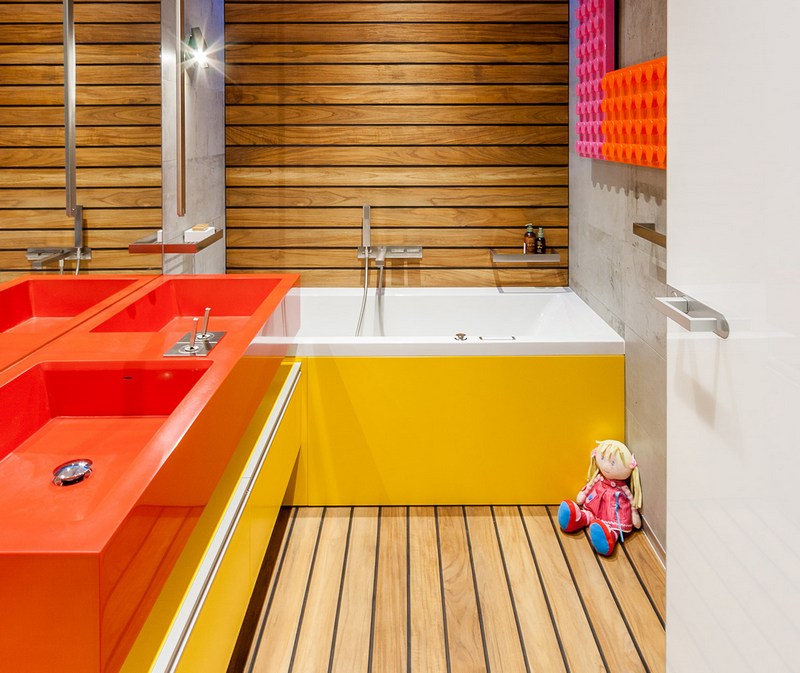 The combination of red and yellow in the bathroom