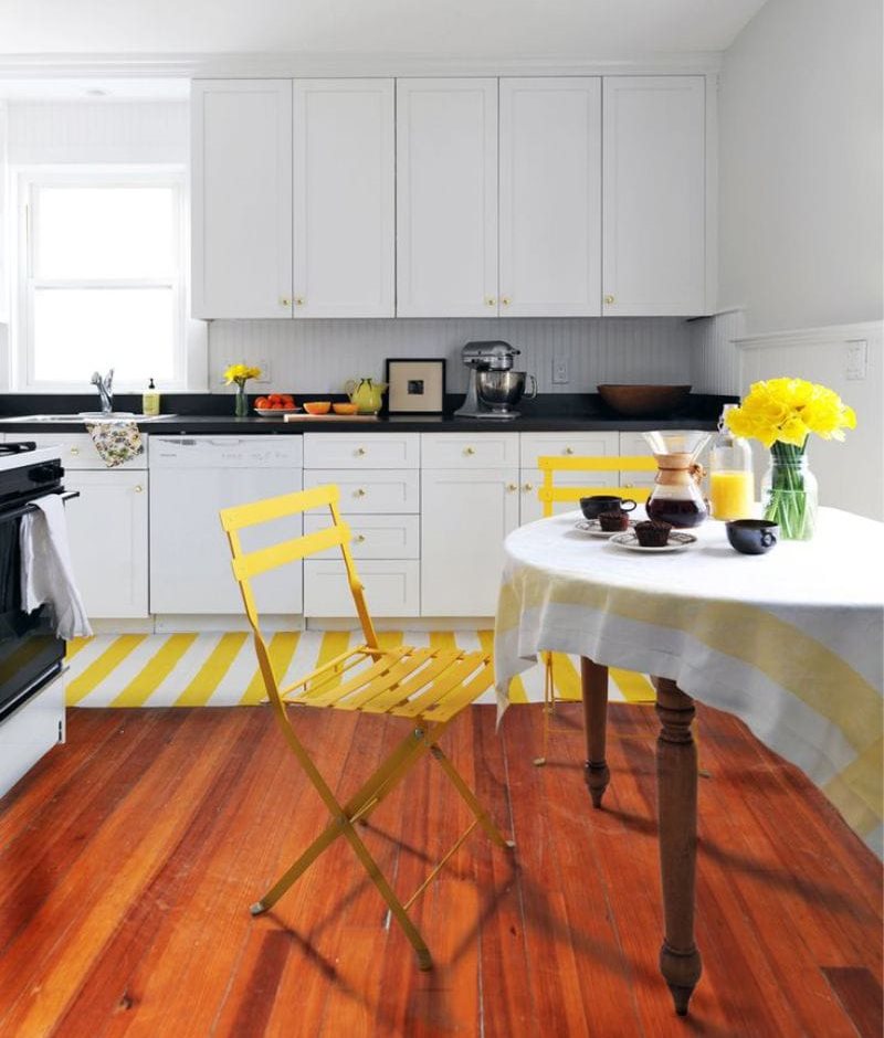 Yellow color in the interior of the black and white kitchen 10 square meters