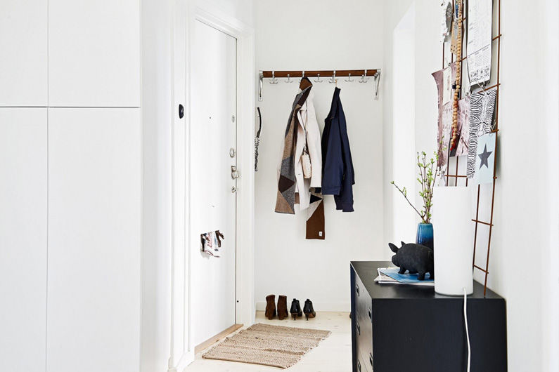 Compact hallway interior in white