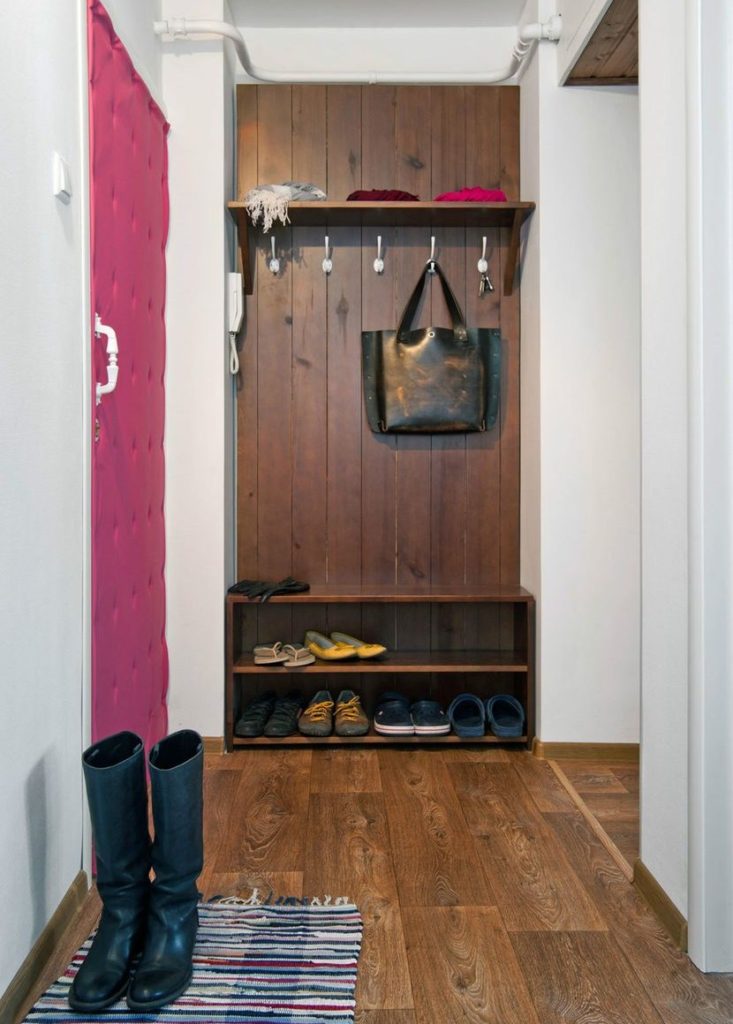 Wooden hanger with hooks for clothes