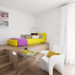 Yellow bed in a white room