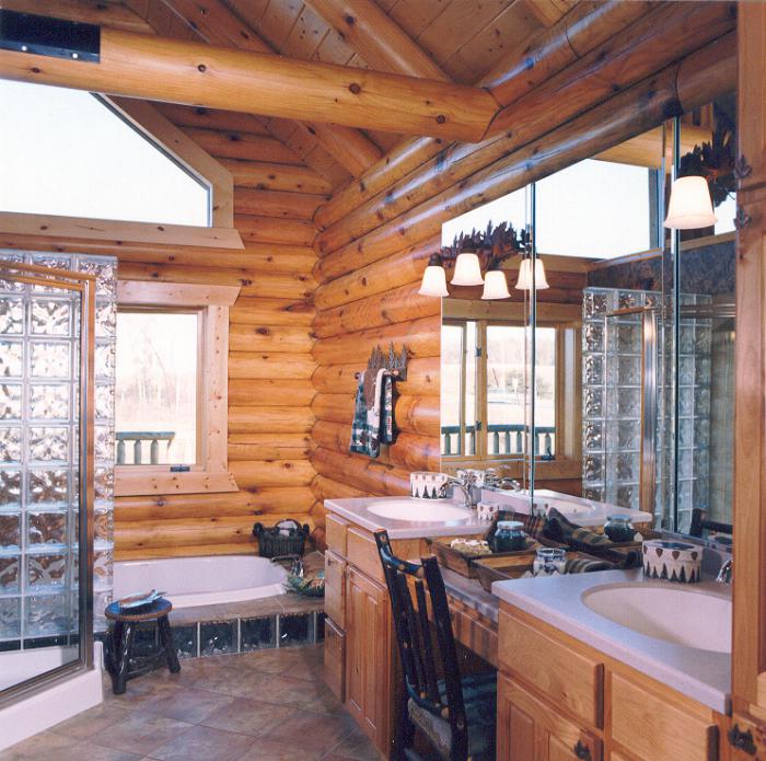 Two washbasins in the bathroom of a wooden house