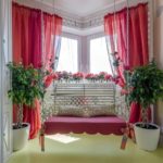 Red curtains on the bay window